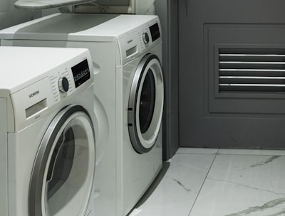 a washer and dryer sitting next to each other